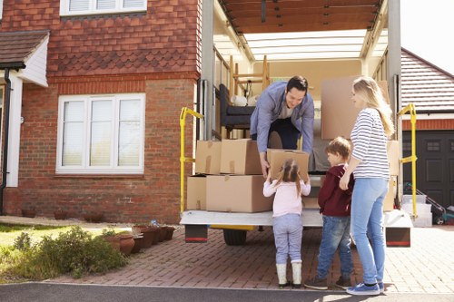 Removal team loading household furniture for a UK move