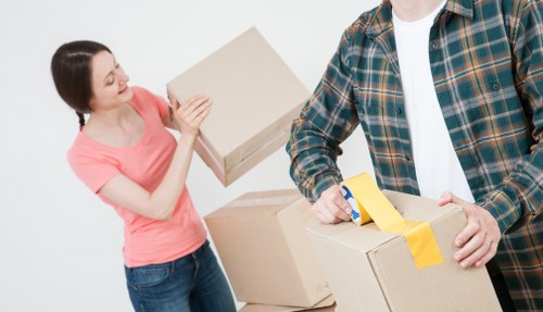 Removal team preparing furniture with safety equipment during a Bermondsey move