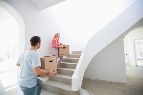 Local movers handling a flat move with careful access planning